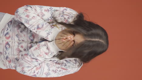 Vertical-video-of-The-sneezing-young-woman.-Patient.